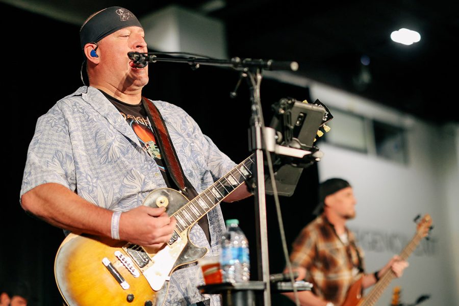 2 musicians performing on stage