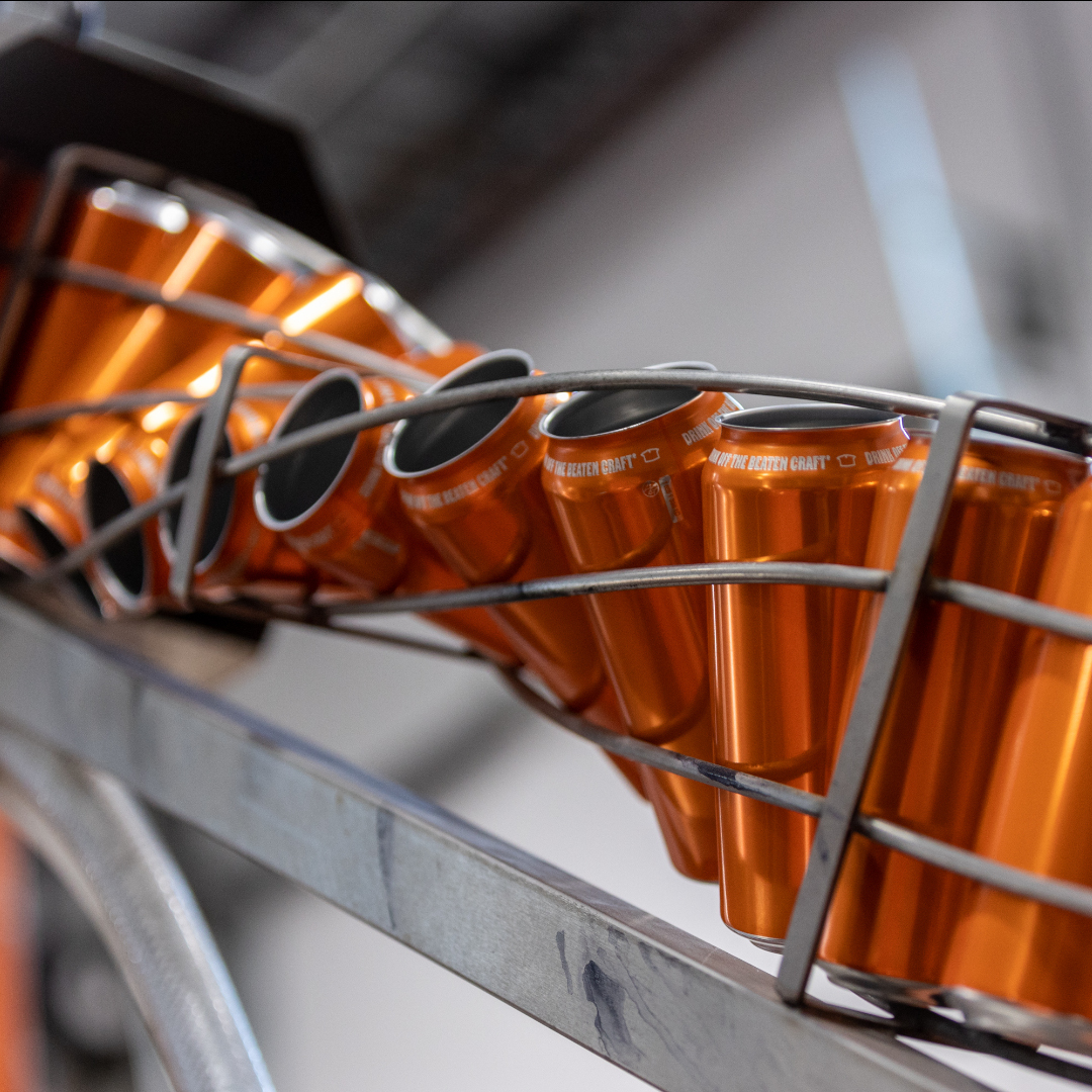 empty cans on a beer canning line