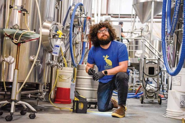 Bearded brewer in brewhouse