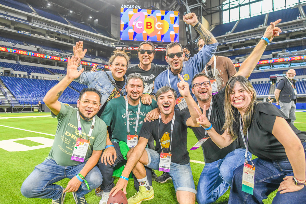 Group of CBC attendees on the turf at Lucas Oil Stadium in Indianapolis