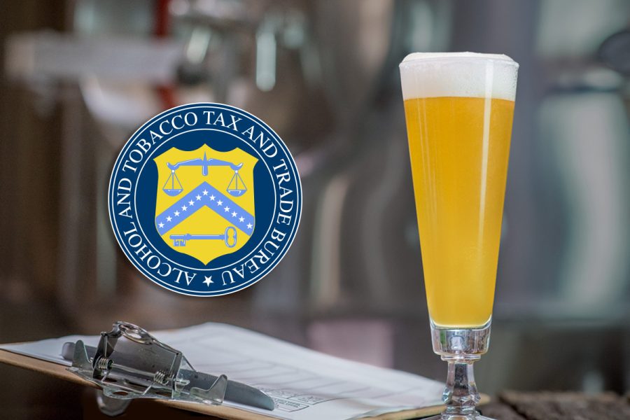 beer next to clipboard in brewery with TTB logo