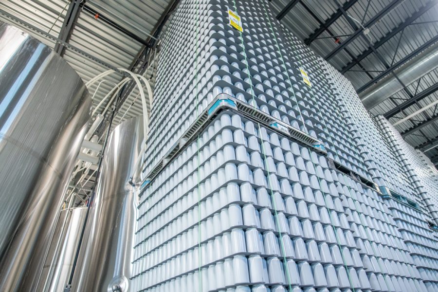 cans and kegs in a beer production setting