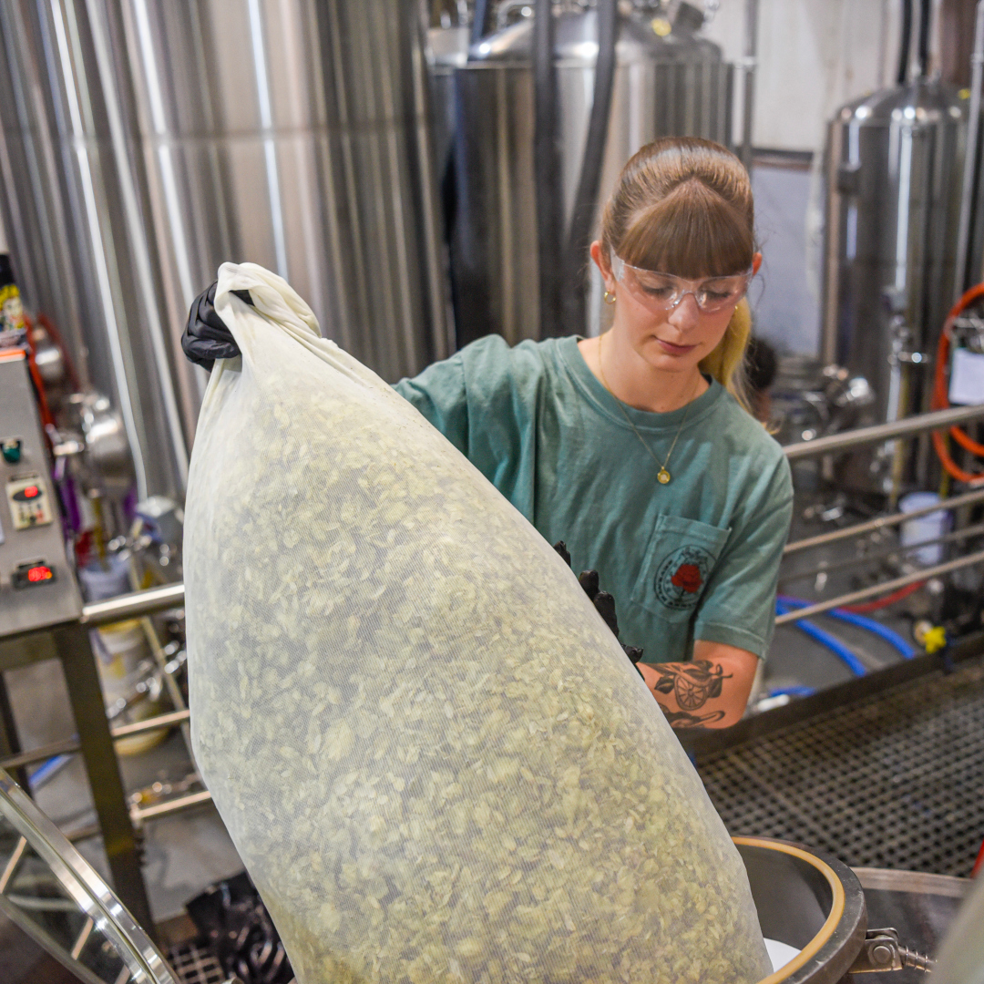 brewer adding hops