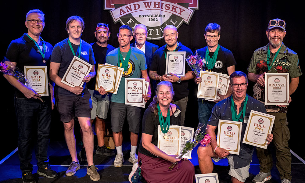 brewers posing with awards
