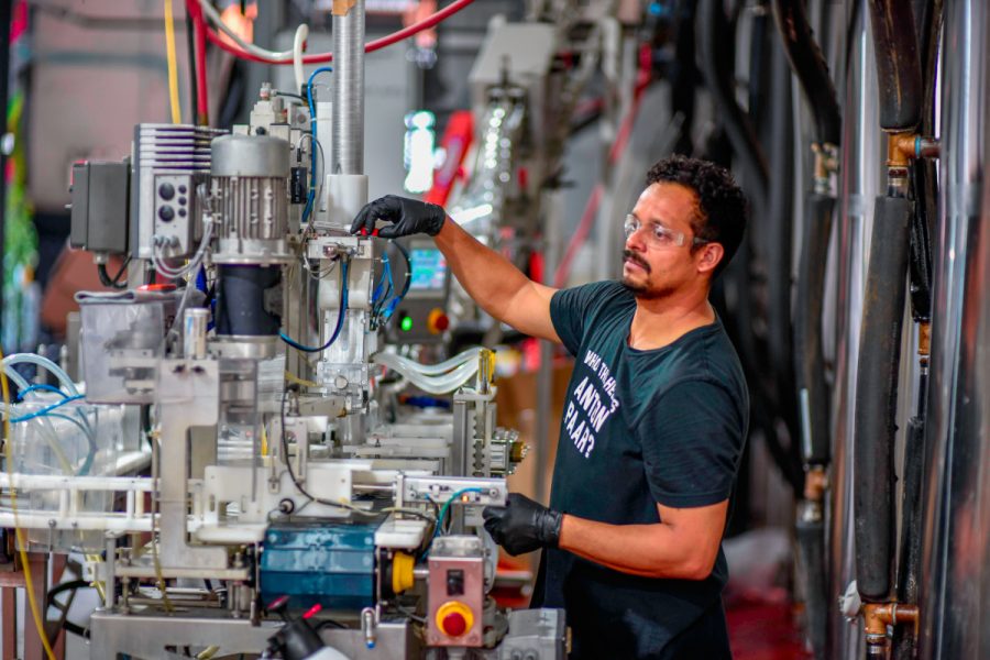 worker in a brewery setting