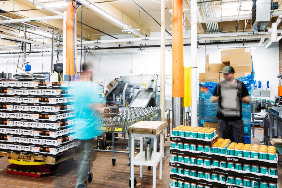 people working on brewery canning line