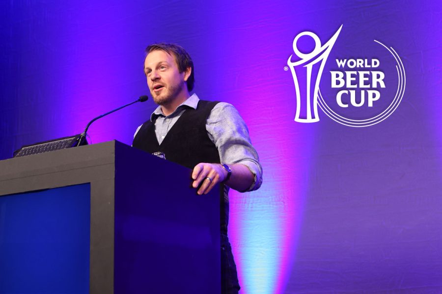 Chris Williams presenting at podium with World Beer Cup logo