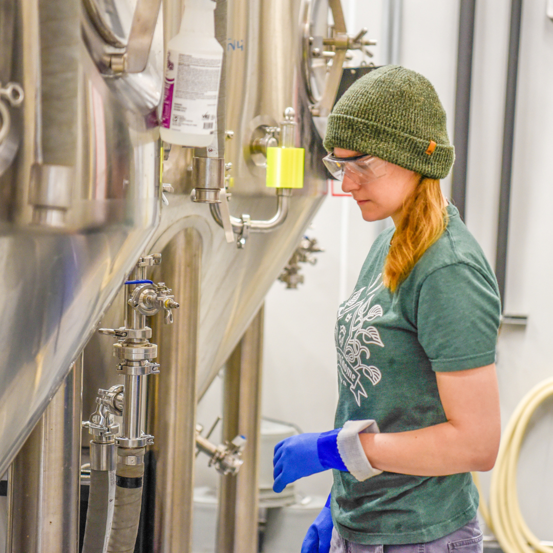 brewery worker near tanks