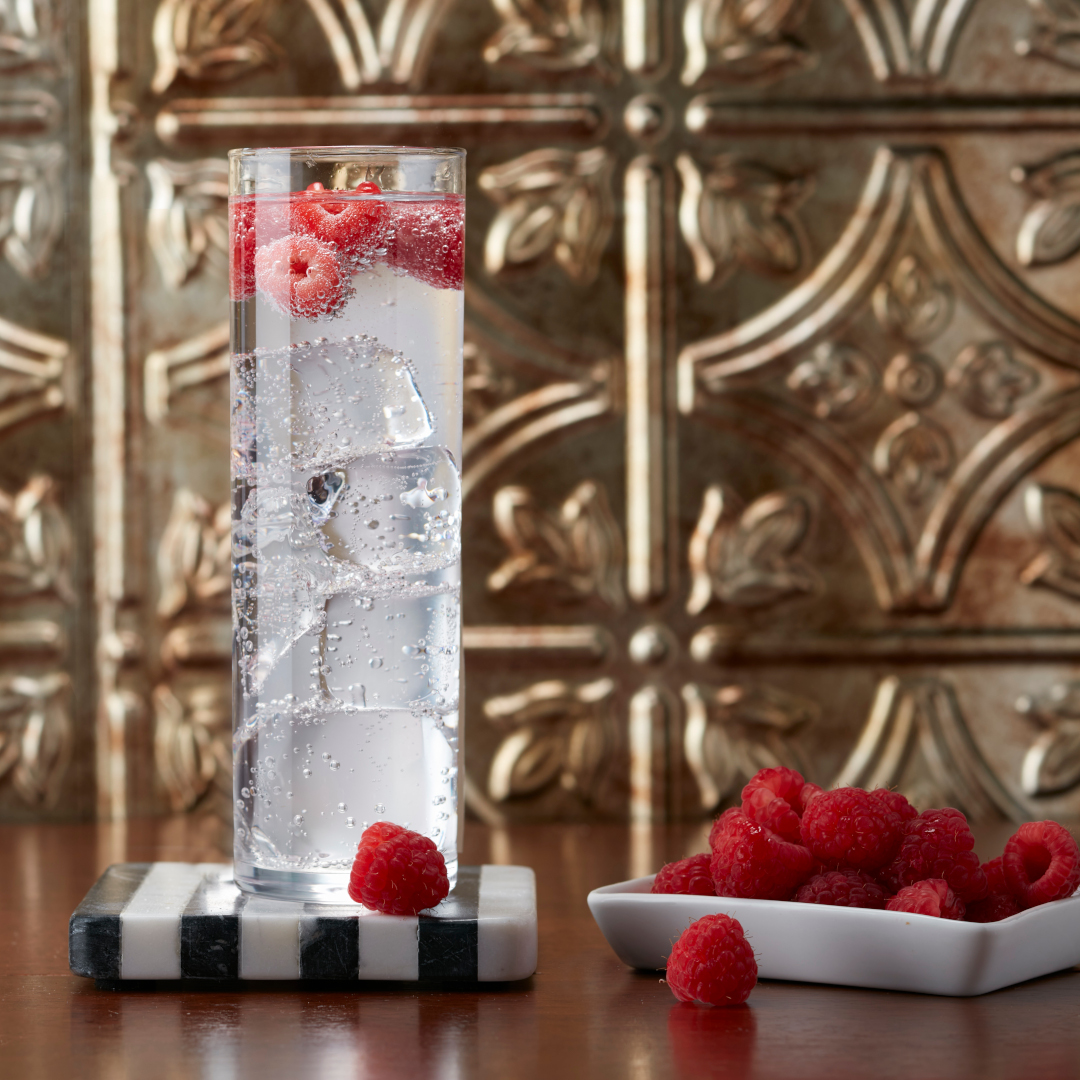 seltzer beverage with fresh rasberries