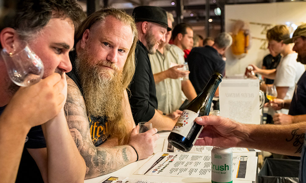 guests at craft beer pavillion counter