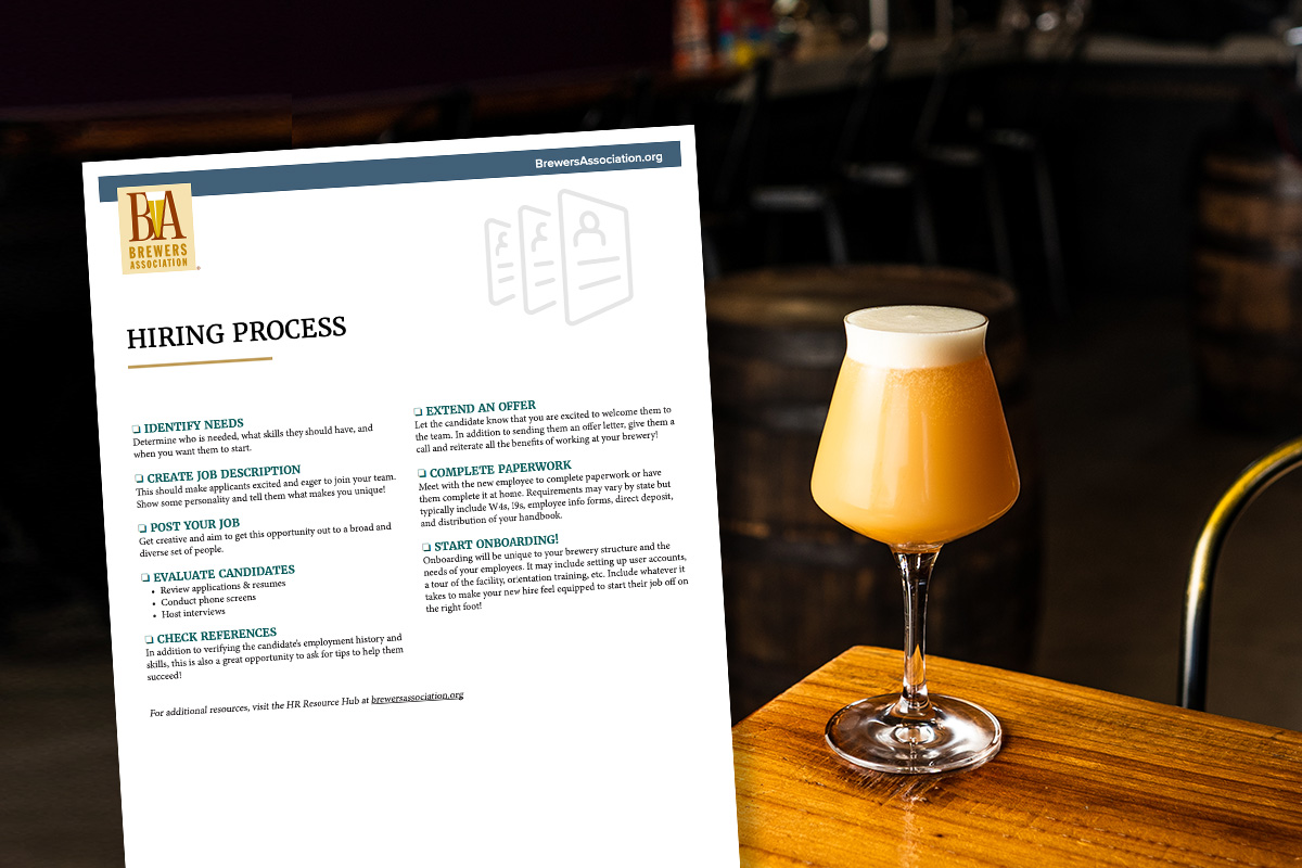 beer on table with human resources document overlaid