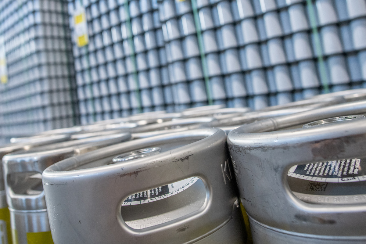 kegs and pallets of aluminum cans