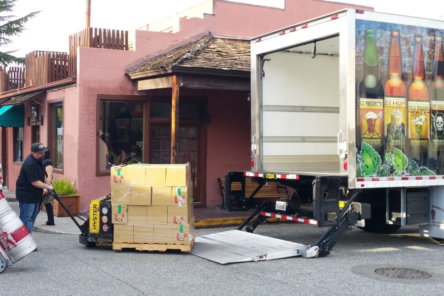 man loading cases of beer into truck