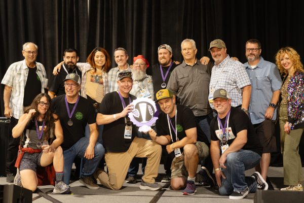 A homebrew club poses with their NHC trophy.