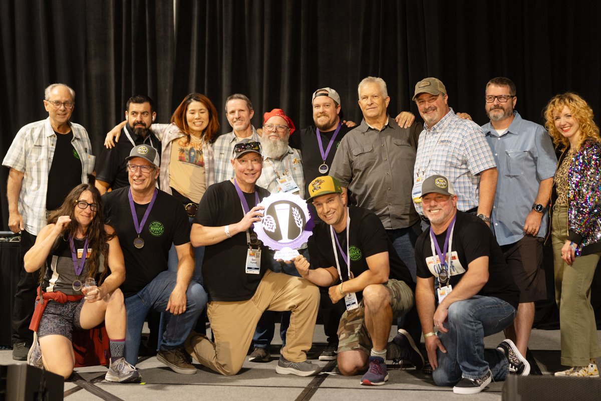 A homebrew club poses with their NHC trophy.