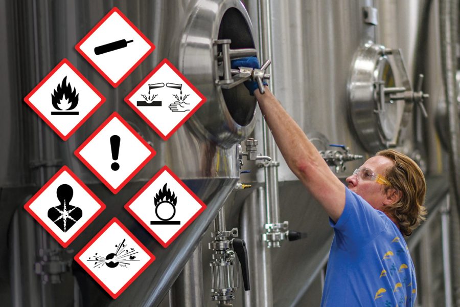 person cleaning kegs with chemical hazard icons