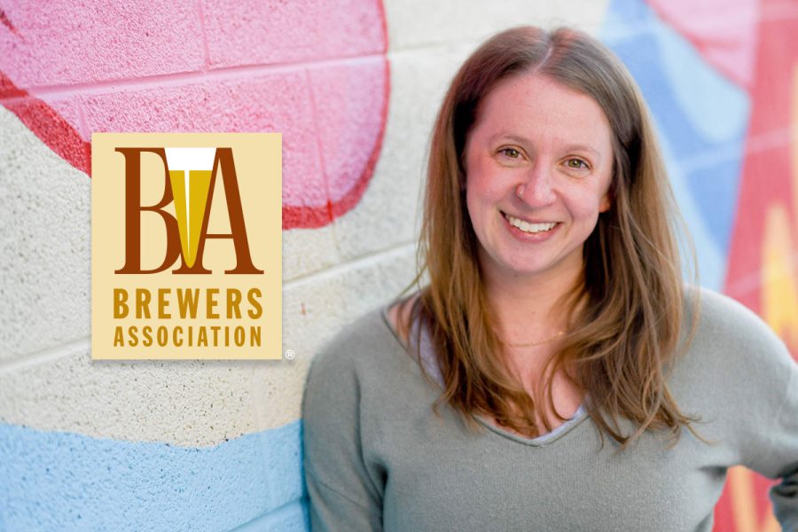 Sarah Billiu pictured against colorful background wall with BA logo