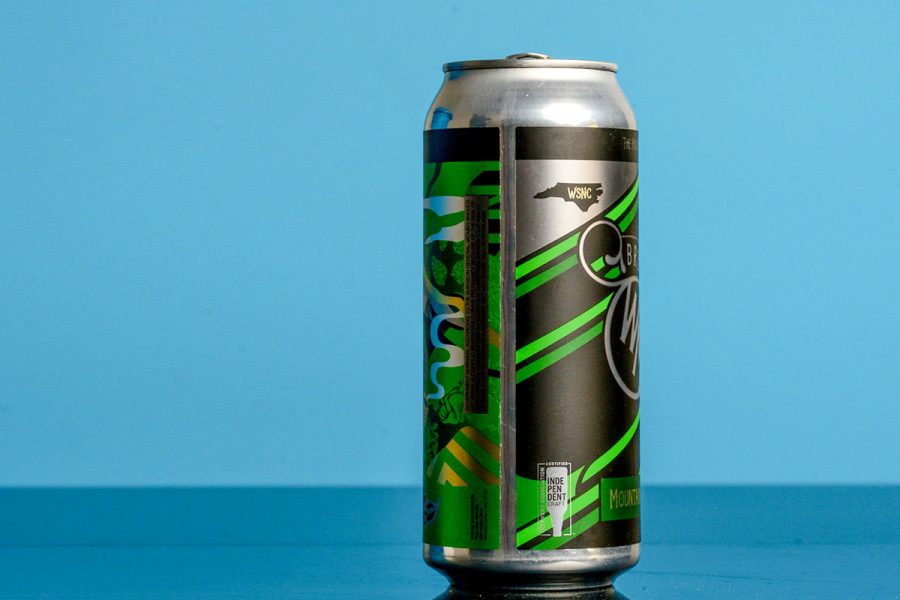 single beer can on blue background