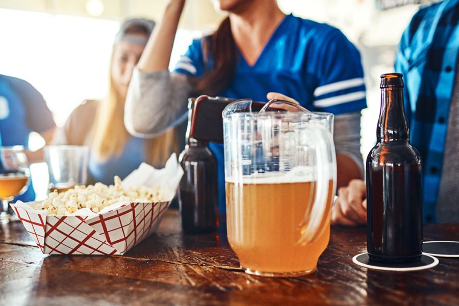 viewing party with pitcher of beer and popcorn