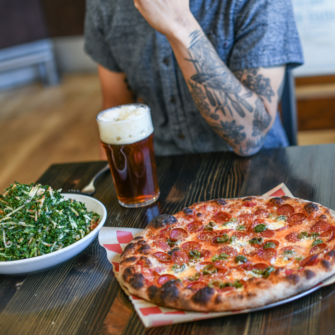 Pizza and beer on a table
